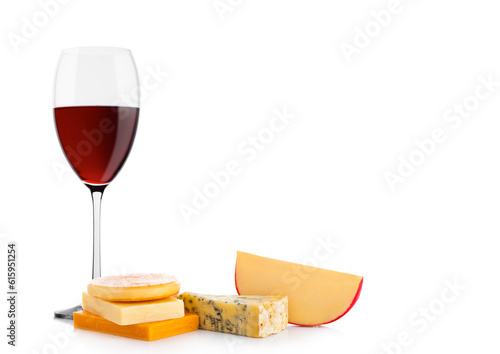 Glass of red wine with cheese selection and grapes on white background