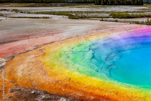 Rainbow-colored hot springs- Visit geothermal areas with rainbow-colored hot springs, such as the Grand Prismatic Spring in Yellowstone National Park, showcasing vibrant hues caused by mineral-rich wa