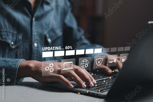 Businessman working and installing update process. Software updates or operating system upgrades to keep your device up to date with enhanced functionality in new versions and improved security.