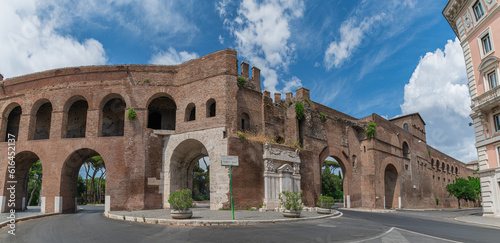 old town wall in Rome with gate at Largo federico fellini, Italy