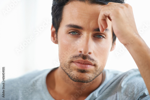 Serious man, closeup and face of handsome model or resting hand on head on isolated and white background. Portrait of Spanish male person, clean skin or facial aesthetic with confidence and blue eyes