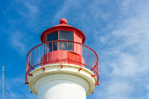 Red top of the lighthouse at the entrance of the port of Saint-Martin-de-Ré, France