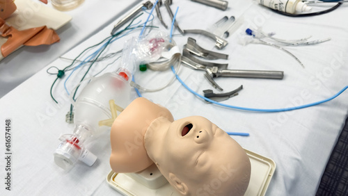 Hospital airway kit signifies emergency airway management. Endotracheal tube, supraglottic airway, laryngoscope, and Ambu bag symbolize crucial interventions for respiratory support