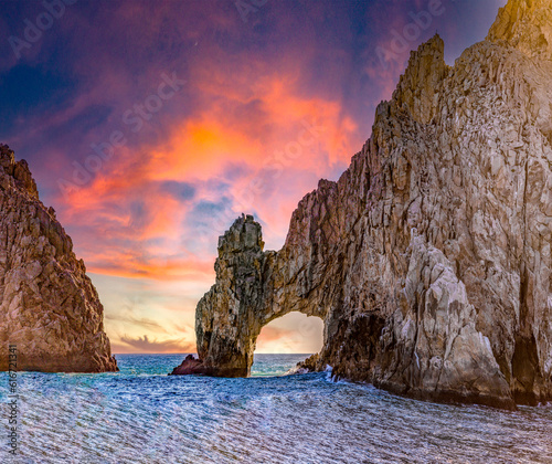 Cape Saint Luke Arch under a beautiful sunset over the Gulf of California that separates the Sea of Cortez from the Pacific Ocean, landscapes of Baja California Sur, Mexico.