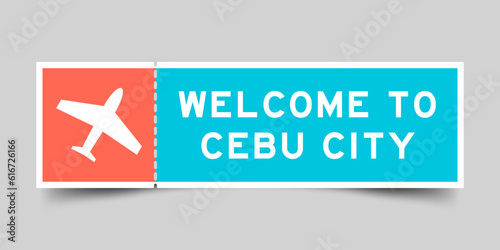Orange and blue color ticket with plane icon and word welcome to cebu city on gray background