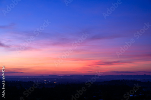 Evening time of panorama mountain under dramatic twilight sky and cloud. Nightfall Silhouette mountain on sunset.