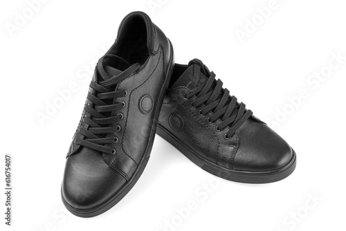 black leather sneakers on a white background