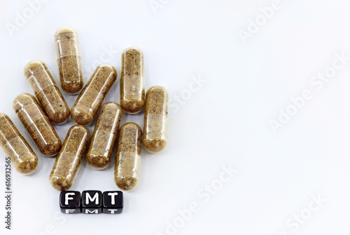 Fecal transplant or fecal matter transplant (FMT). Pills or medicines with fecal microbiota to cure persistent digestive diseases such as infection by Clostridium bacteria