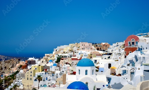 Oia buildings and blue domes on cliffside