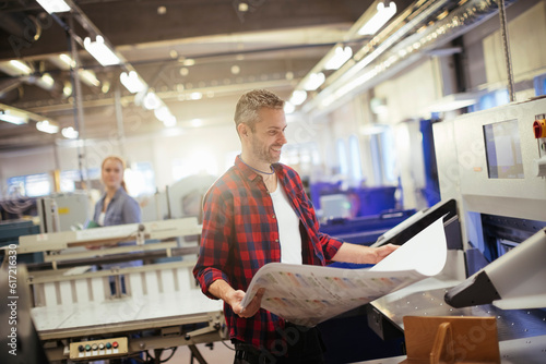 Mid adult man working in a printing press office