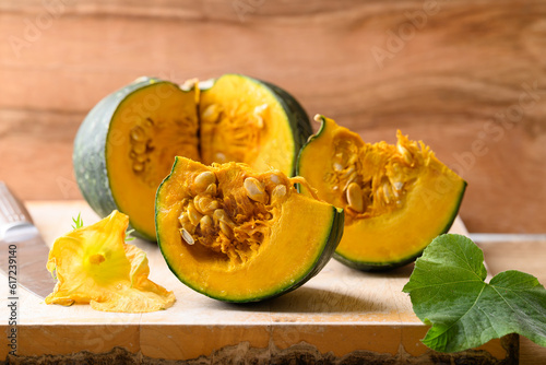 Green Japanese pumpkin on wooden board prepare for cooking