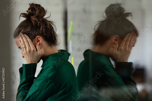 Young sad woman in office, having problem.