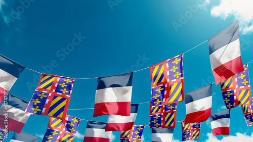 Flag of Borgona - France against the sky, flags hanging vertically