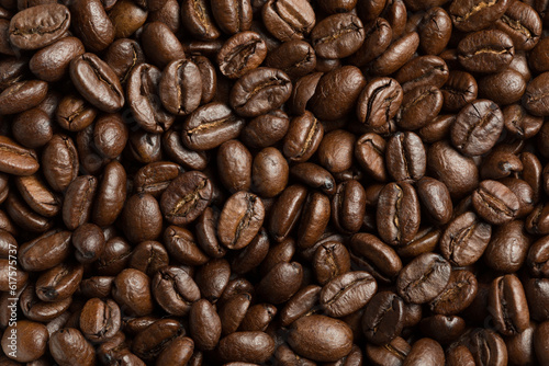 Abstract roasted coffee beans background. Macro photo