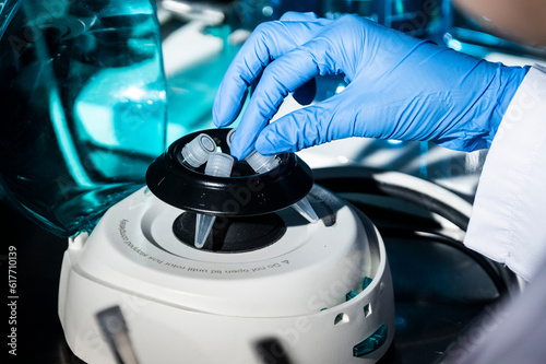 Close-up of a scientist's hand doing research with centrifuge in a laboratory