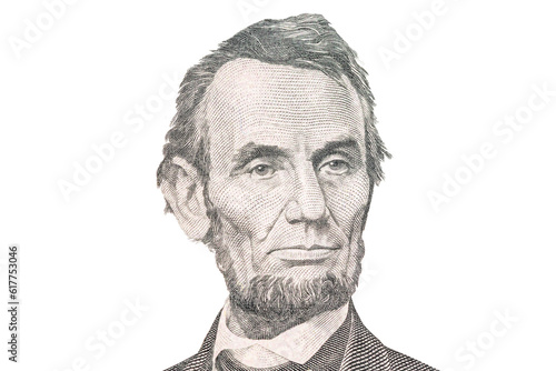 Portrait of US president Abraham Lincoln. Face Lincoln on USA 5 dollar bill closeup isolated. America money