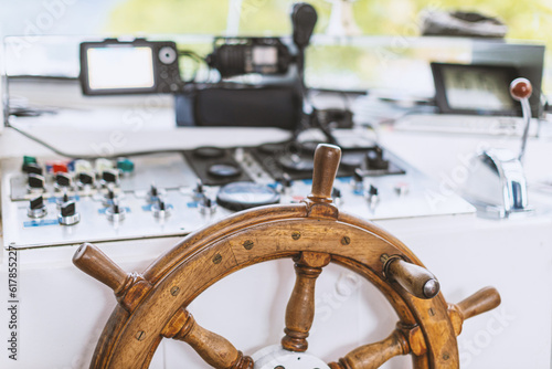 The old helm on a modern ship. The ship's wheel, and all control dash board.
