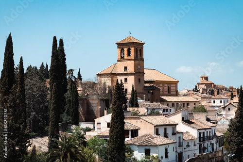 Granada,Spain. April 14, 2022: Albaicin neighborhood San Ildefonso Cathedral with blue sky.