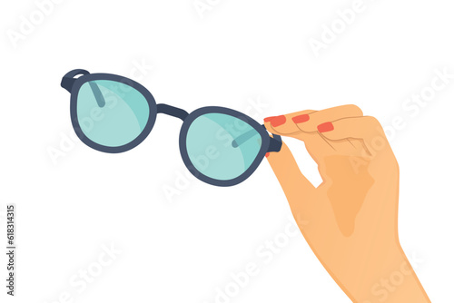 female hand holding sunglasses- vector illustration