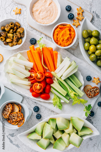 Crudites platter, raw vegetarian food or party vegetarian platter with various veggie snacks and dips