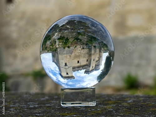 Tarascon, May 2023 : Visit the beautiful city of Tarascon in Provence - View on the castle Through a lens ball