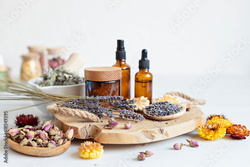 Botanical blends, herbs, essencial oils for naturopathy. Natural remedy, herbal medicine, blends for bath and tea on wooden table background