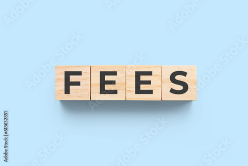 Fees wooden cubes on blue background