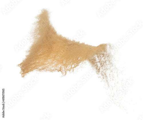 Sand flying explosion, Golden grain wave explode. Abstract cloud fly. Yellow colored sand splash throwing in Air. White background Isolated high speed shutter, throwing freeze stop motion