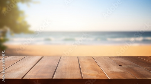 Wooden board empty table top on of blurred background. Perspective brown wood table over blur in summer beach background