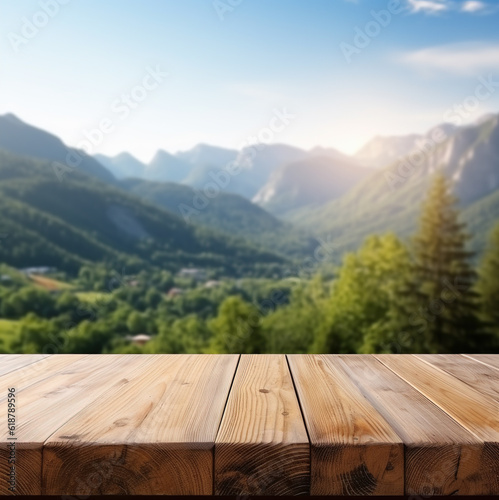 Empty wooden surface and blurred mountain landscape background.