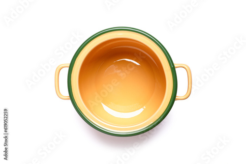 Yellow ceramic cooking pot or saucepan isolated on white background with clipping path, top view, flat lay.