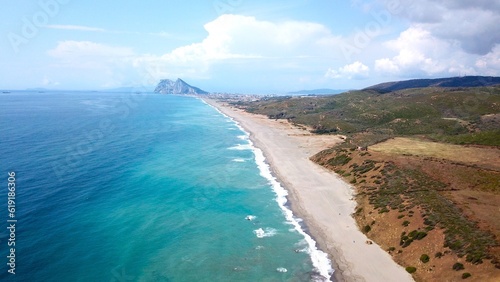 aerial view along the beach near La Alcaidesa with a view towards the Rock of Gibraltar and Africa at the horizon, Playa de la Hacienda, Mediterranean Sea, Andalusia, Malaga, Spain