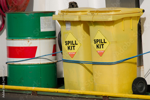 Spill kit yellow wheelie bin for health and safety of chemical, oil, diesel or petrol pollution leak