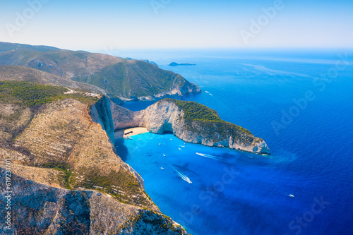 View of Navagio beach, Zakynthos Island, Greece. Aerial landscape. Azure sea water. Rocks and sea. Summer landscape from the air. Vacation time.
