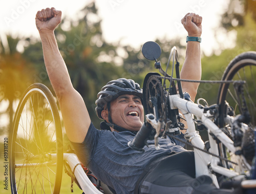 Winner, athlete and a man with a disability and bike for handicap for race, fitness and recumbent challenge. Exercise, achievement and a handbike of paraplegic sports person at competition for cardio