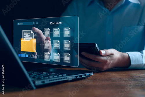 Document management and network system concept. Businessman use smart tablet loading documents in online archives ,Document management Storage and technology on digital document paperless operation.