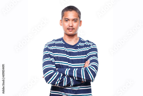 Portrait of young man with crossed arms isolated on white background