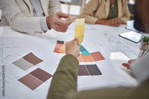 Creative, color sample and team in a meeting for an interior design project in office boardroom. Industry, collaboration and team of designers in discussion while working with blueprints in workplace