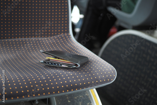 left wallet on a public bus seat 