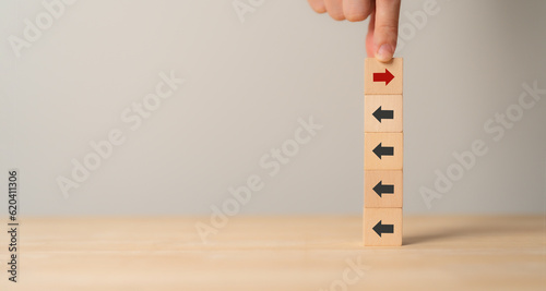 New ways of working, differentiation strategy concept symbol on wood blocks. Providing uniqueness, different and distinct from competitors, creating competitive advantage. Business direction concept.