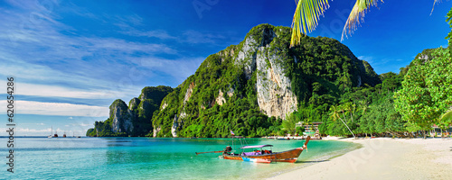 koh phi phi thailand with long tail boat on beach