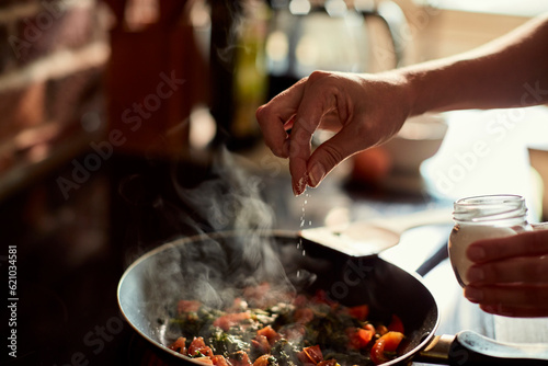 Young woman cooking in the kitchen