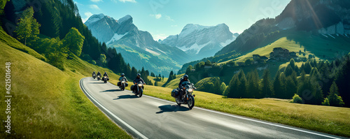 Motorcyclists ride on a winding road against the backdrop of mountains