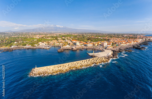 View of Stazzo old city, Catania, Sicily, Italy. Summer beach and sea