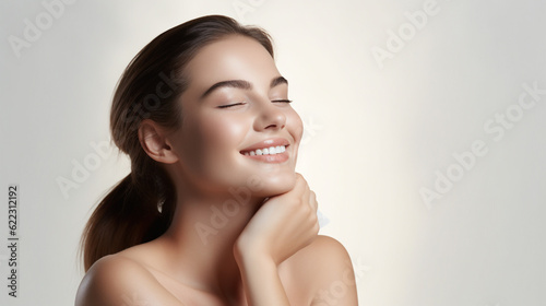 Beautiful Woman with Perfect Skin Touching Her Skin After A Treatment. Dermatology, Spa, Skin Care Concept