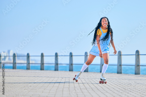 Skating, portrait and woman with happiness on the promenade for fun and weekend skate. Summer, smile and person with mockup while on roller skates for a trendy activity, hobby and vacation in street