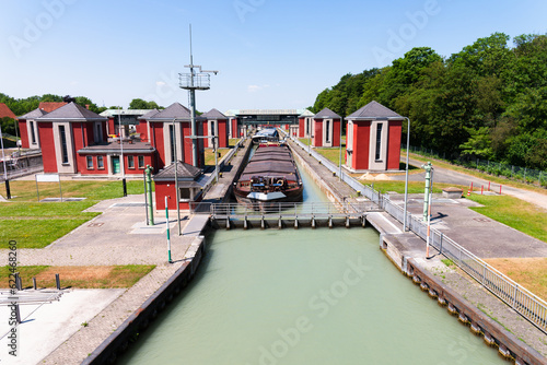 Cargo boats in water basin at Hindenburgschleuse mittellandkanal canal water basin, lifted to higher surface level ready to leave the hub. Anderten, Hannover, Germany.