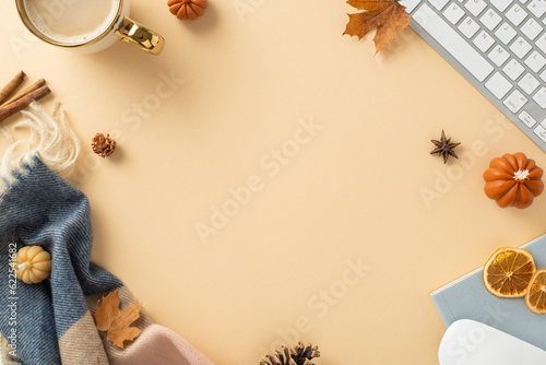 Cozy autumn workspace: Top view photograph showcasing keyboard, mouse, hot coffee, patchy scarf and maple leaves. Set against a pastel isolated background, it offers copyspace for text or advertising