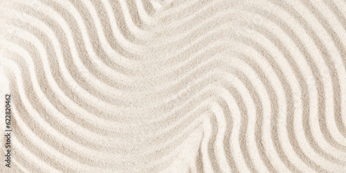 Sand pattern as background. Zen pattern in white sand. Beach sand texture in summer sun.
