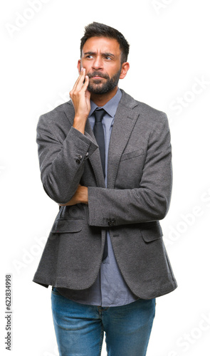 Adult hispanic business man over isolated background thinking looking tired and bored with depression problems with crossed arms.